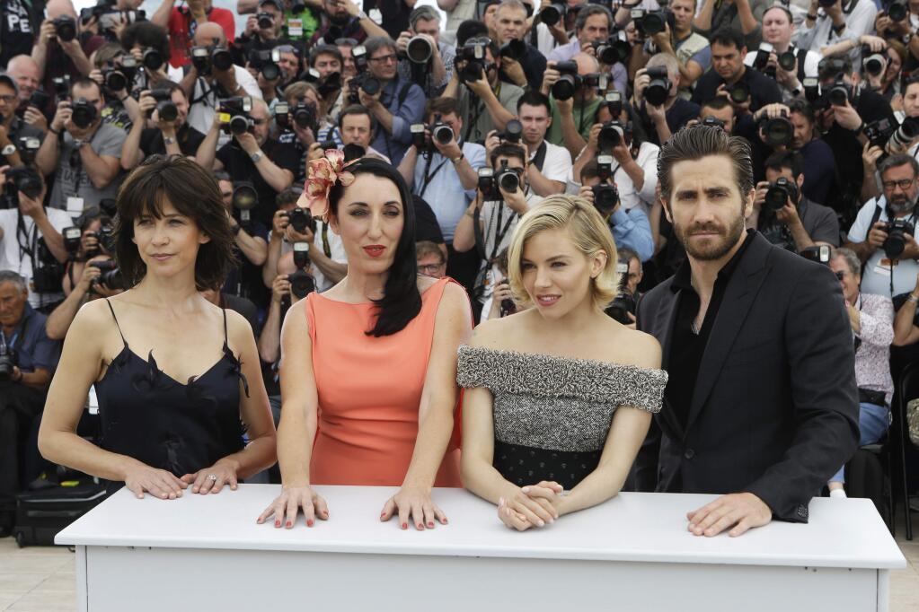 From left, Sophie Marceau, Rossy de Palma, Sienna Miller and Jake Gyllenhaal pose for photographers during a photo call for members of the jury, at the 68th international film festival, Cannes, southern France, Wednesday, May 13, 2015. (AP Photo/Lionel Cironneau)