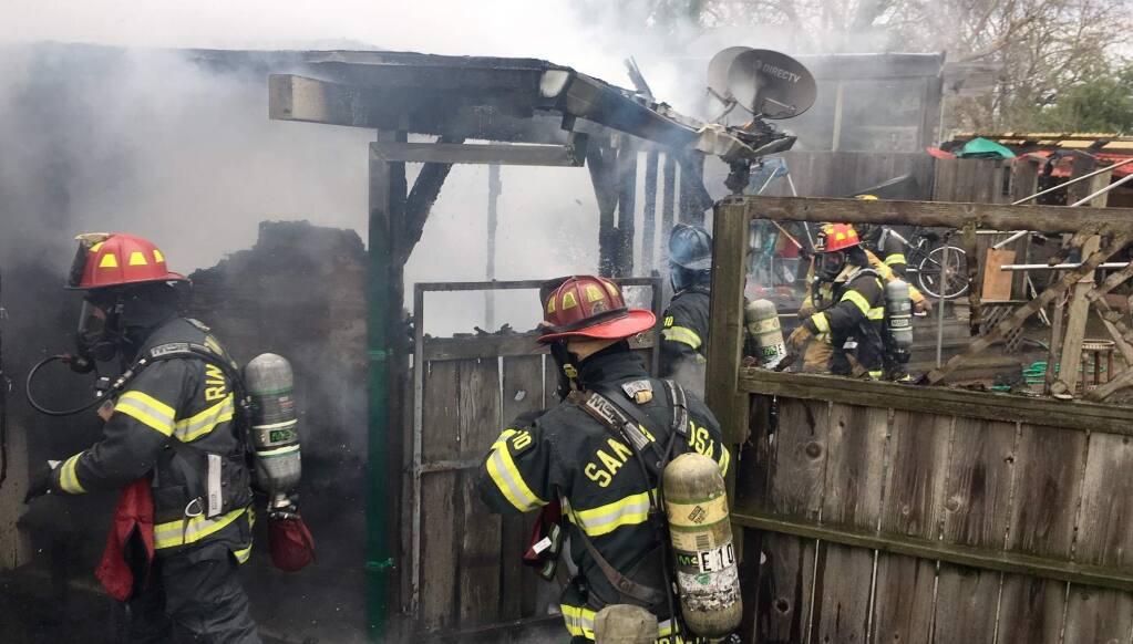 Firefighters battle a blaze at a home in southwest Santa Rosa on Tuesday, Jan. 15, 2019. (KENT PORTER/ PD)