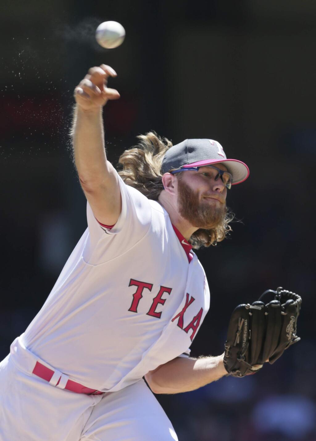 Texas Rangers starting pitcher A.J. Griffin throws during the first inning of a baseball game against the Oakland Athletics in Arlington, Texas, Sunday, May 14, 2017. (AP Photo/LM Otero)