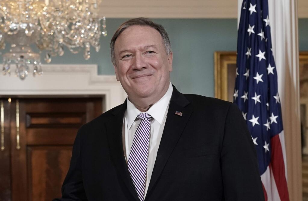 Secretary of State Mike Pompeo smiles during a meeting with Foreign Minister Abdullah bin Zayed bin Sultan Al Nahyan of the United Arab Emirates, at the State Department in Washington, Friday, Nov. 22, 2019. (AP Photo/J. Scott Applewhite)