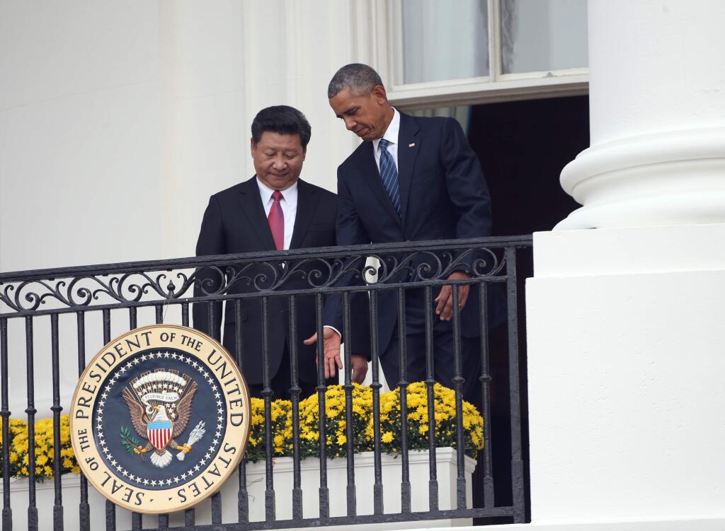 Chinese President Xi Jinping announced a landmark commitment to limit and greenhouse gas emissions during a visit to the White House last week. (DOUG MILLS / New York Times)