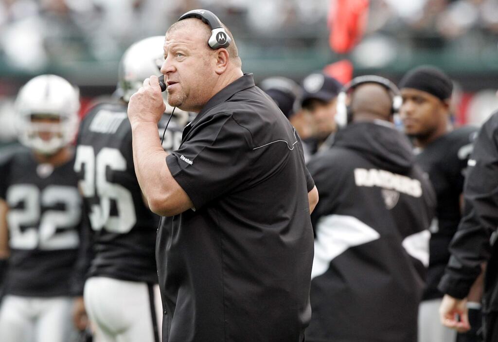 Oakland Raiders head coach Tom Cable guides his team from the sideline against the Kansas City Chiefs in Oakland on Sunday, Nov. 8, 2010. (Christopher Chung / The Press Democrat)