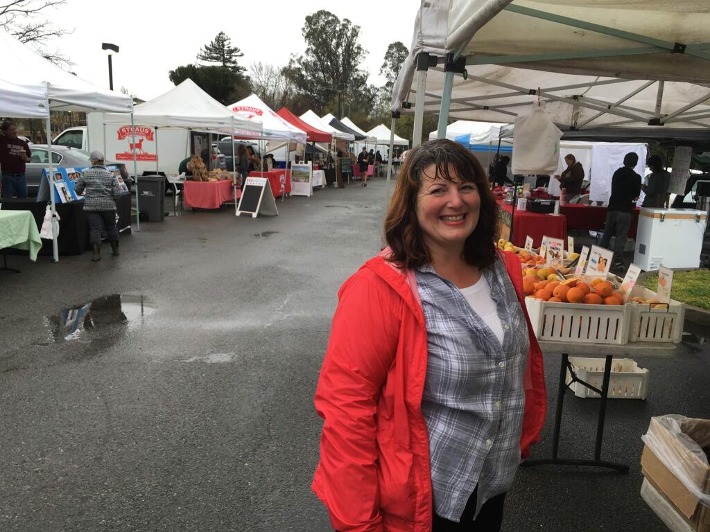 Kelly Smith, Farmer's Market Manager, handles everything from puddles and rain to last-minute cancellations at the weekly Farmer's Market at Lucchesi Park.