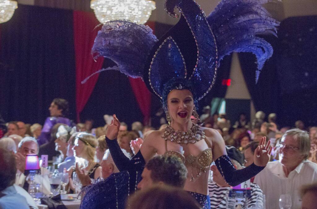 Cabaret dancers circulated throughout the dining room at the La Luz fundraiser, Noche au Moulin Rouge, at the Sonoma Veterans Hall on Saturday, August 3. (Photo by Robbi Pengelly/Index-Tribune)