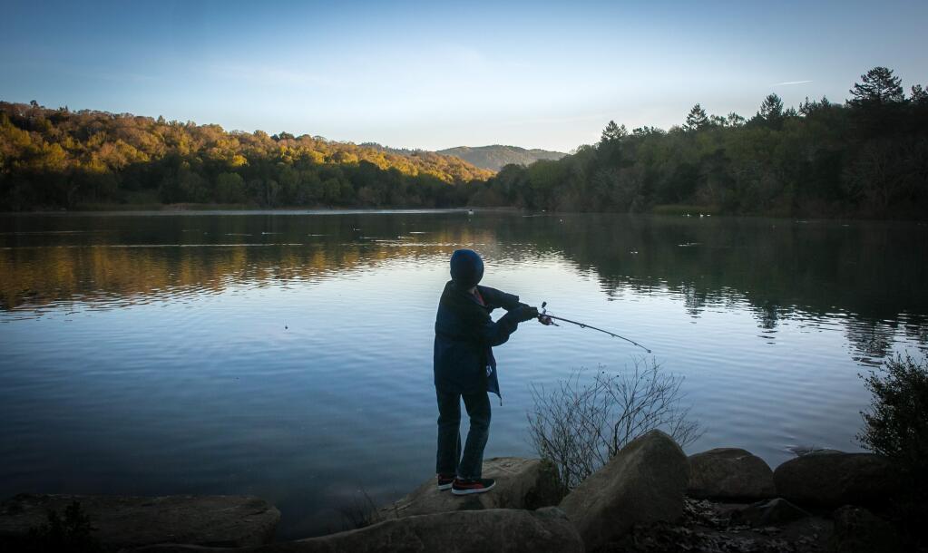 Pedro Martinez III casts his line during the 2016 Fishing Derby for Kids at Lake Ralphine Sunday, February 7, 2016, in Santa Rosa's Howarth Park. Martinez and his dad skipped church to compete in the derby. (Jeremy Portje / For The Press Democrat)