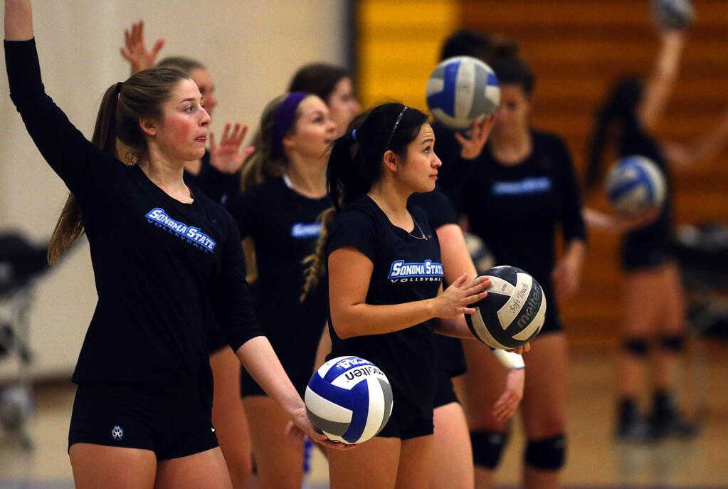 SSU volleyball players practice serving at practice in October. (JOHN BURGESS / The Press Democrat)