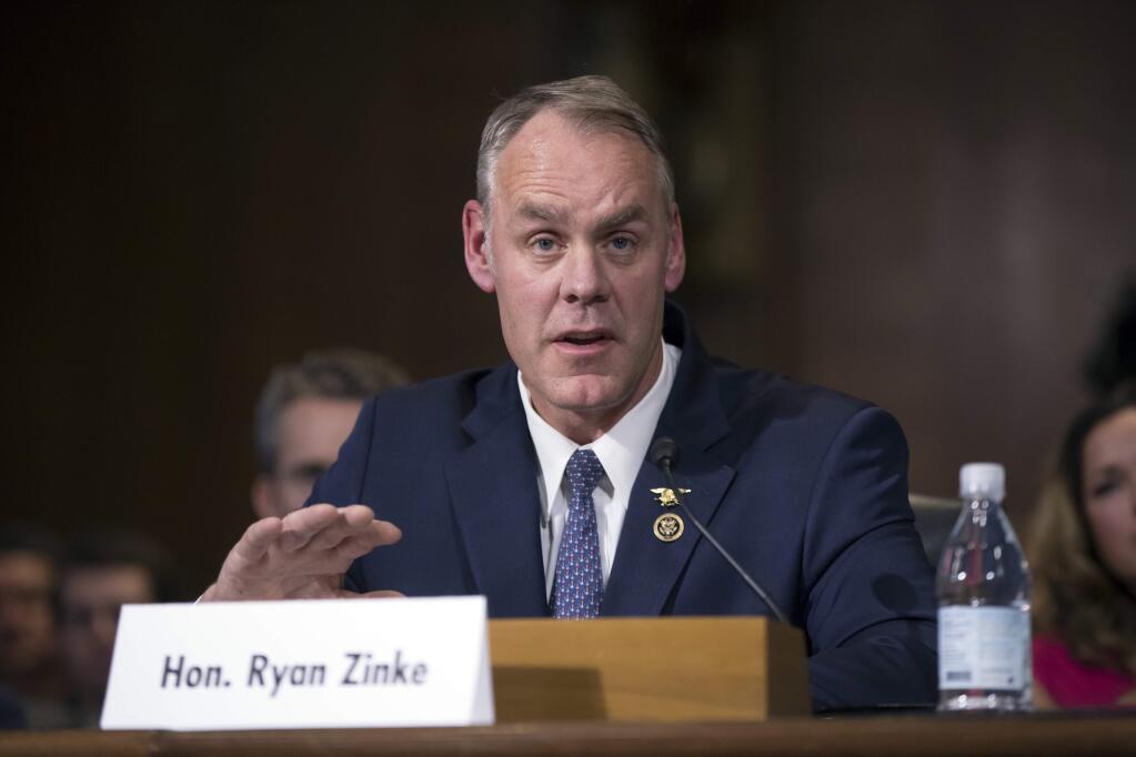 FILE - In this Jan. 17, 2017, file photo, Interior Secretary-nominee, Rep. Ryan Zinke, R-Mont. testifies on Capitol Hill in Washington. Zinke appears headed toward confirmation as the nation's next interior secretary, responsible for more than 400 million acres of public land, mostly in the West. A vote in the Senate is expected to happen on March 1. (AP Photo/J. Scott Applewhite, File)