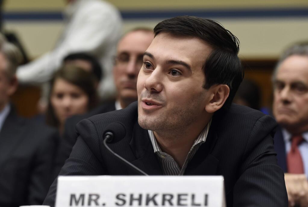Pharmaceutical chief Martin Shkreli speaks on Capitol Hill in Washington, Thursday, Feb. 4, 2016, during the House Committee on Oversight and Reform Committee hearing on his former company's decision to raise the price of a lifesaving medicine. Shkreli refused to testify before U.S. lawmakers who excoriated him over severe hikes for a drug sold by a company that he acquired. (AP Photo/Susan Walsh)