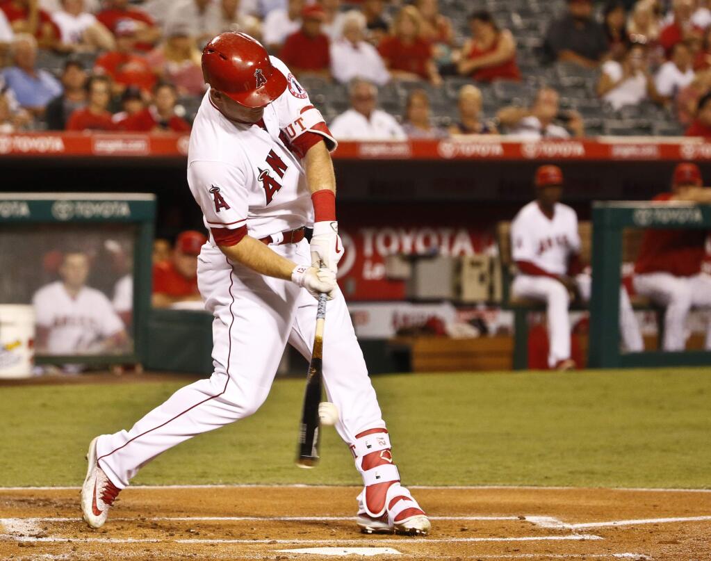 Los Angeles Angels' Mike Trout swings for a base hit against the Oakland Athletics during the first inning of baseball game Monday, Sept. 26, 2016, in Anaheim, Calif. (AP Photo/Lenny Ignelzi)