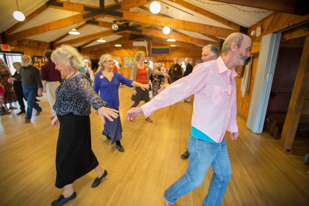 Guests step to the calls of Sharon Green during North Bay Country Dance Society's English Country Dance at Wischemann Hall in Sebastopol, Calif. Sunday, February 5, 2017. The North Bay Country Dance Society typically meet the 1st & 3rd Sunday of the month. (Jeremy Portje / For The Press Democrat)