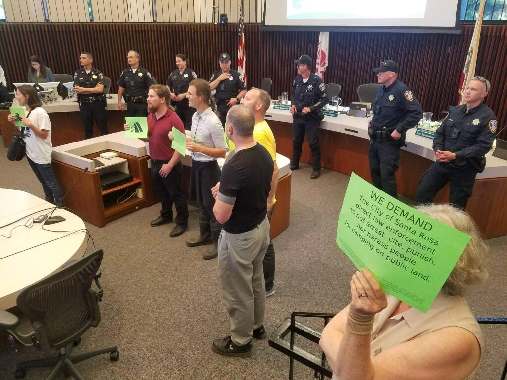 Six people were arrested after they disrupted the Santa Rosa City Council meeting on Tuesday, May 1, 2018. (KEVIN MCCALLUM/ PD)