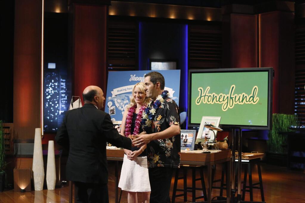 Honeyfund co-founders Sara and Josh Margulis greet venture capitalist Kevin O'Leary during an appearance on the ABC television show 'Shark Tank.' (©ABC/Kelsey McNeal)