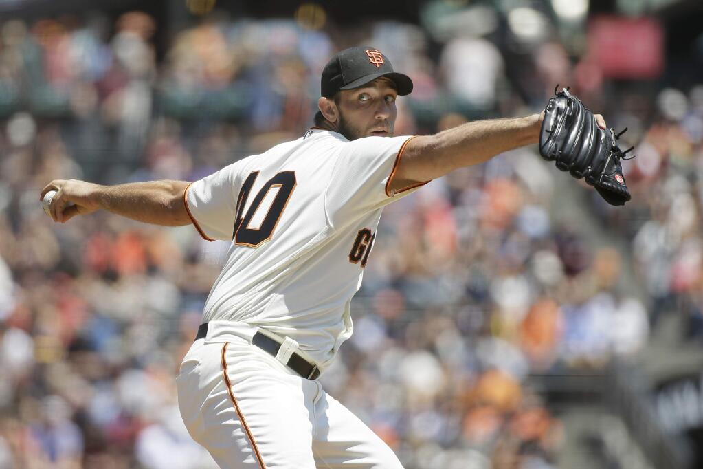 San Francisco Giants starting pitcher Madison Bumgarner throws in the first inning of a baseball game against the Cincinnati Reds Wednesday, July 27, 2016, in San Francisco. (AP Photo/Eric Risberg)