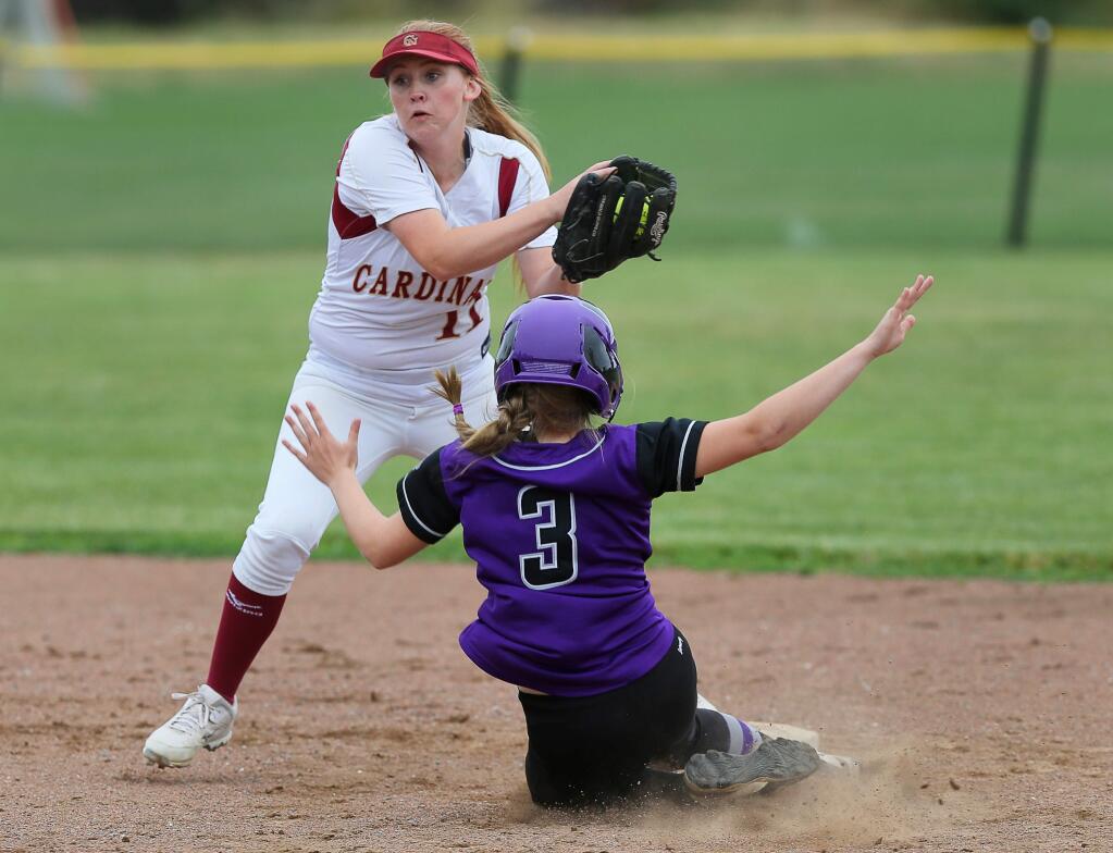 Cardinal Newman's Haley Titone forces out Fort Bragg's Sophia Valasquez at second base, during their game in Santa Rosa on Wednesday, May 23, 2018. (Christopher Chung / The Press Democrat)