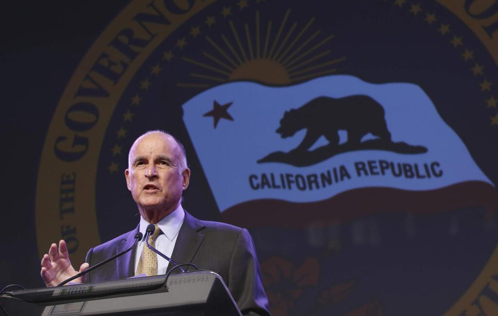 FILE - In this May 18, 2016 file photo, California Gov. Jerry Brown gestures during a community event in Sacramento, Calif. Brown is preparing to sign a bill to automatically enroll millions of private-sector workers in retirement savings accounts. The legislation is an attempt to address the growing concern that many workers will be financially unprepared to retire. Gov. Brown says he'll sign it on Thursday, Sept. 29, 2016. (AP Photo/Rich Pedroncelli, File)