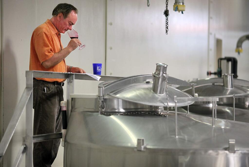 11/10/2010: D7:PC: Winemaker Rob Davis samples wine from the tanks at Jordan Winery on Monday, November 1, 2010.