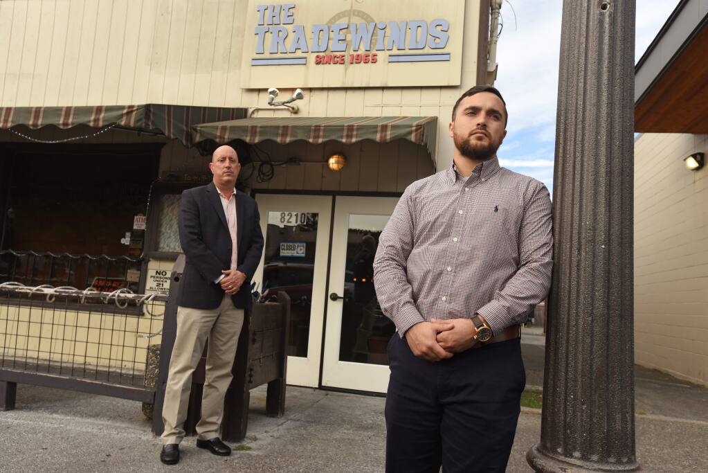 Christopher Joseph Alcala, 25, right, with his attorney Patrick Ciocca stands at The Tradewinds bar where in July 2019 during an arrest Alcala suffered a brain injury and has now filed a federal civil rights suit against Cotati police in downtown Cotati, Calif., on Thursday, June 11, 2020. The assault was captured on security cameras. (Erik Castro/for The Press Democrat)