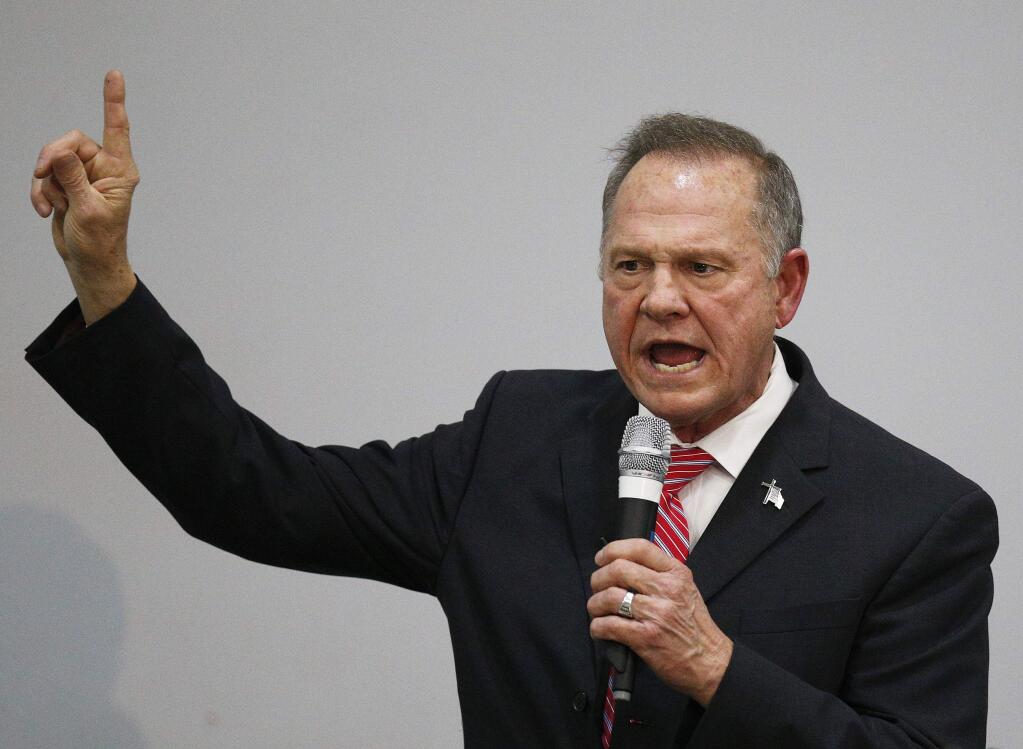 Former Alabama Chief Justice and U.S. Senate candidate Roy Moore speaks at a church revival, Tuesday, Nov. 14, 2017, in Jackson, Ala. (AP Photo/Brynn Anderson)