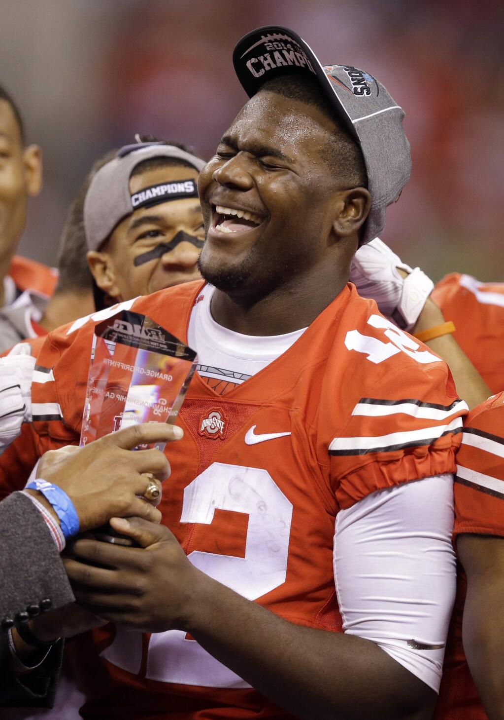Ohio State quarterback Cardale Jones celebrates following the Big Ten Conference championship NCAA college football game after midnight Sunday, Dec. 7, 2014, in Indianapolis. Ohio State defeated Wisconsin 59-0. (AP Photo/Michael Conroy)