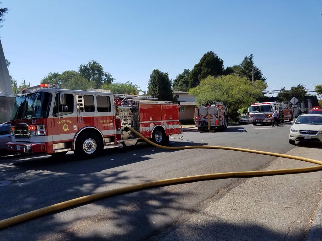 Firefighters responded to a small fire inside the St. Rose Catholic Church in Santa Rosa on Thursday, Aug. 11, 2016. (George Buce/The Press Democrat)