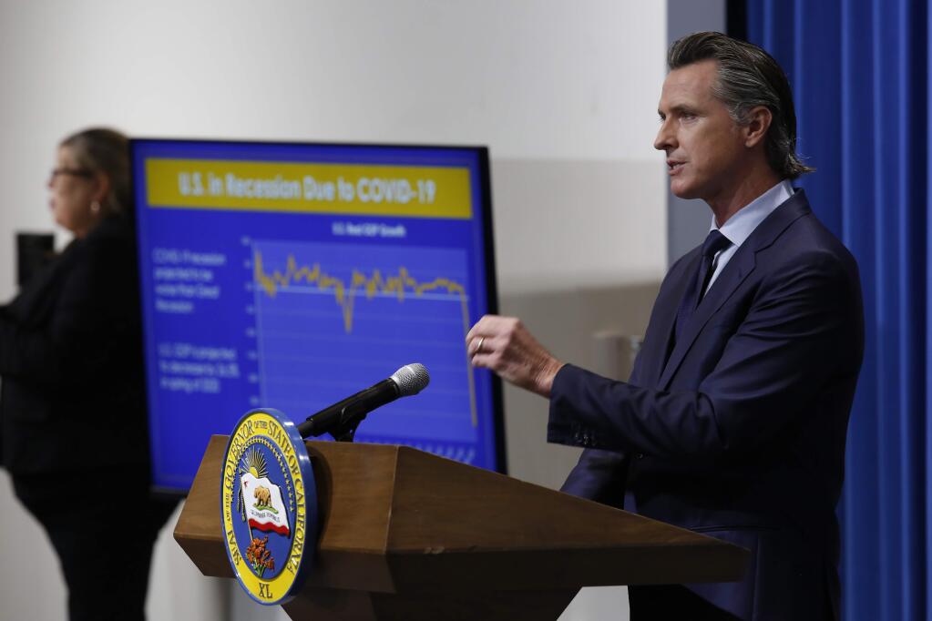 California Gov. Gavin Newsom discusses his revised 2020-2021 state budget during a news conference in Sacramento, Calif., Thursday, May 14, 2020. (AP Photo/Rich Pedroncelli, Pool)