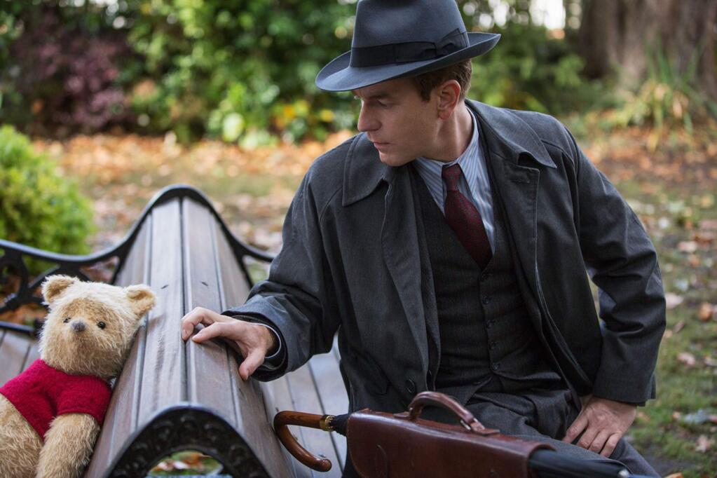 Ewan McGregor as Christopher Robin, a businessman who was once an imaginative boy, and Jim Cummins as the voice of Winnie the Pooh in 'Christopher Robin.' (WALT DISNEY STUDIOS)