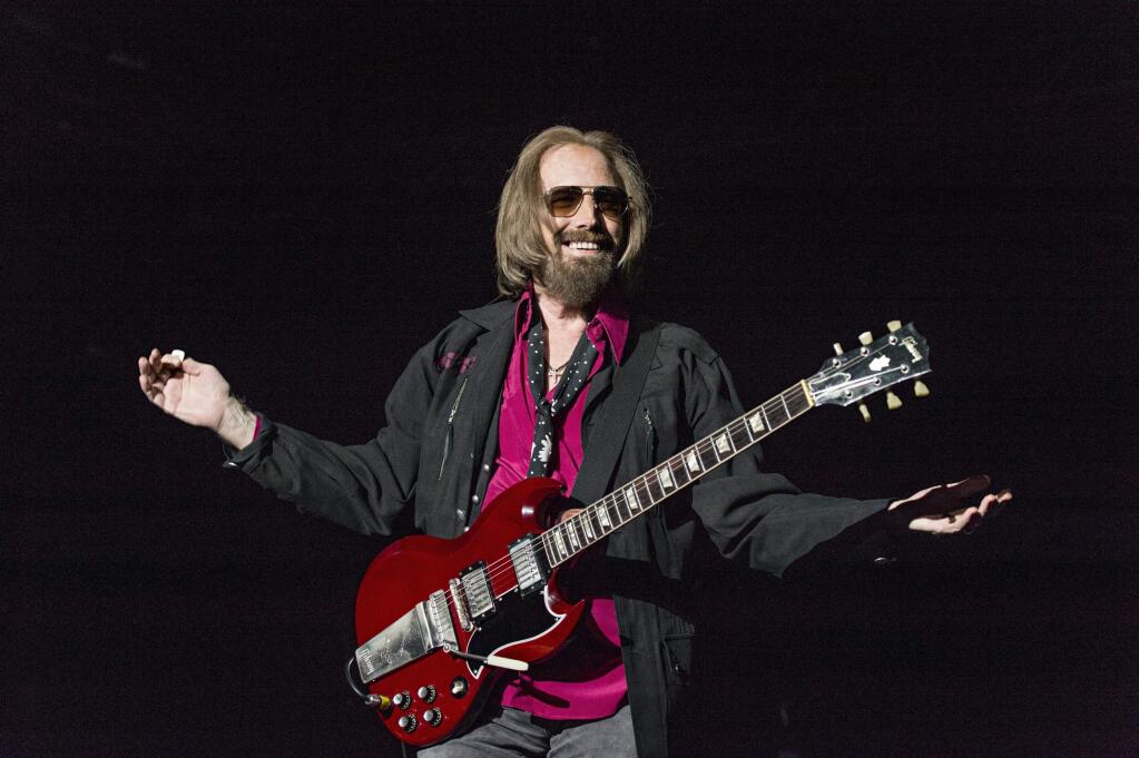 FILE - In a Sunday, Sept. 17, 2017 file photo, Tom Petty and the Heartbreakers perform at KAABOO 2017 at the Del Mar Racetrack and Fairgrounds, in San Diego, Calif. A California real estate agent and self-proclaimed “super fan” says he's extended an offer to buy the Florida home of Petty. Kevin Beauchamp tells The Gainesville Sun he quickly made an offer of $175,000 for the nearly 1,200-square-foot (111-sq. meter) home after seeing the home's current owner Brandy Clark mention on a Petty Facebook fan club that she might sell it. (Photo by Amy Harris/Invision/AP, File)