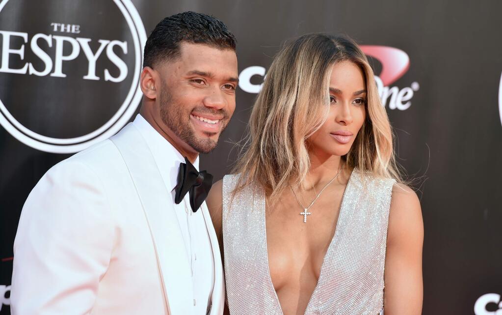 FILE - In this July 13, 2016, file photo, NFL football player Russell Wilson, of the Seattle Seahawks, left, and Ciara arrive at the ESPY Awards at the Microsoft Theater in Los Angeles. Both stars announced that Ciara is expecting the couple's first child in dual Instagram posts on Oct. 25, 2016. (Photo by Jordan Strauss/Invision/AP, File)