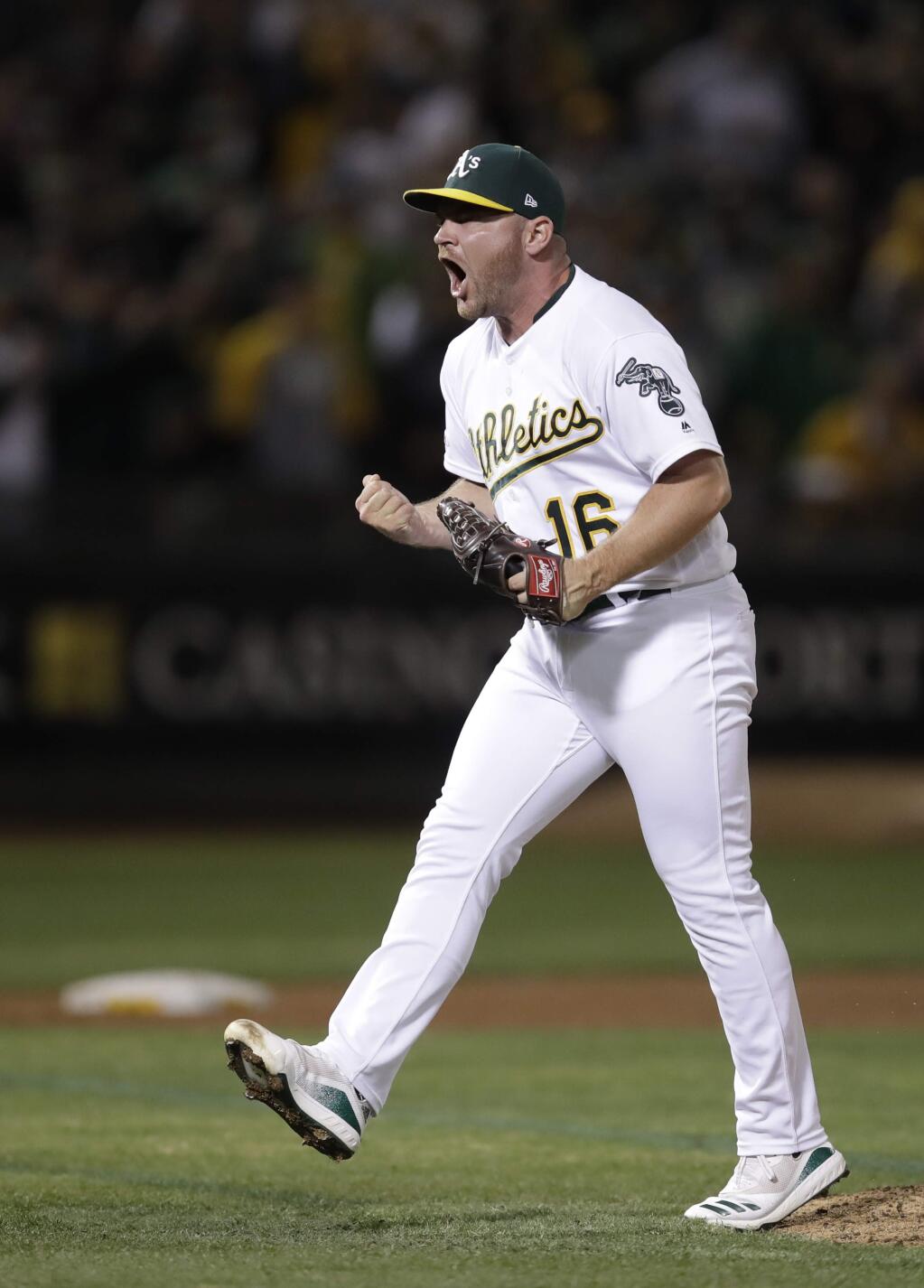Oakland Athletics pitcher Liam Hendriks reacts as the final Kansas City Royals batter is retired Tuesday, Sept. 17, 2019, in Oakland. (AP Photo/Ben Margot)