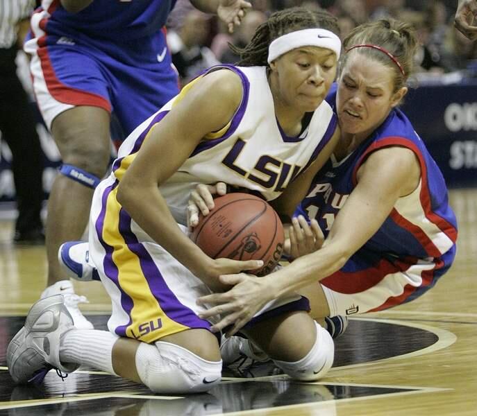 LSU guard Seimone Augustus (33) and DePaul guard Rachael Carney fight for a loose ball in the second half of their NCAA Women's Regional semifinal basketball game in San Antonio, Saturday, March 25, 2006. (AP Photo/Donna McWilliam)