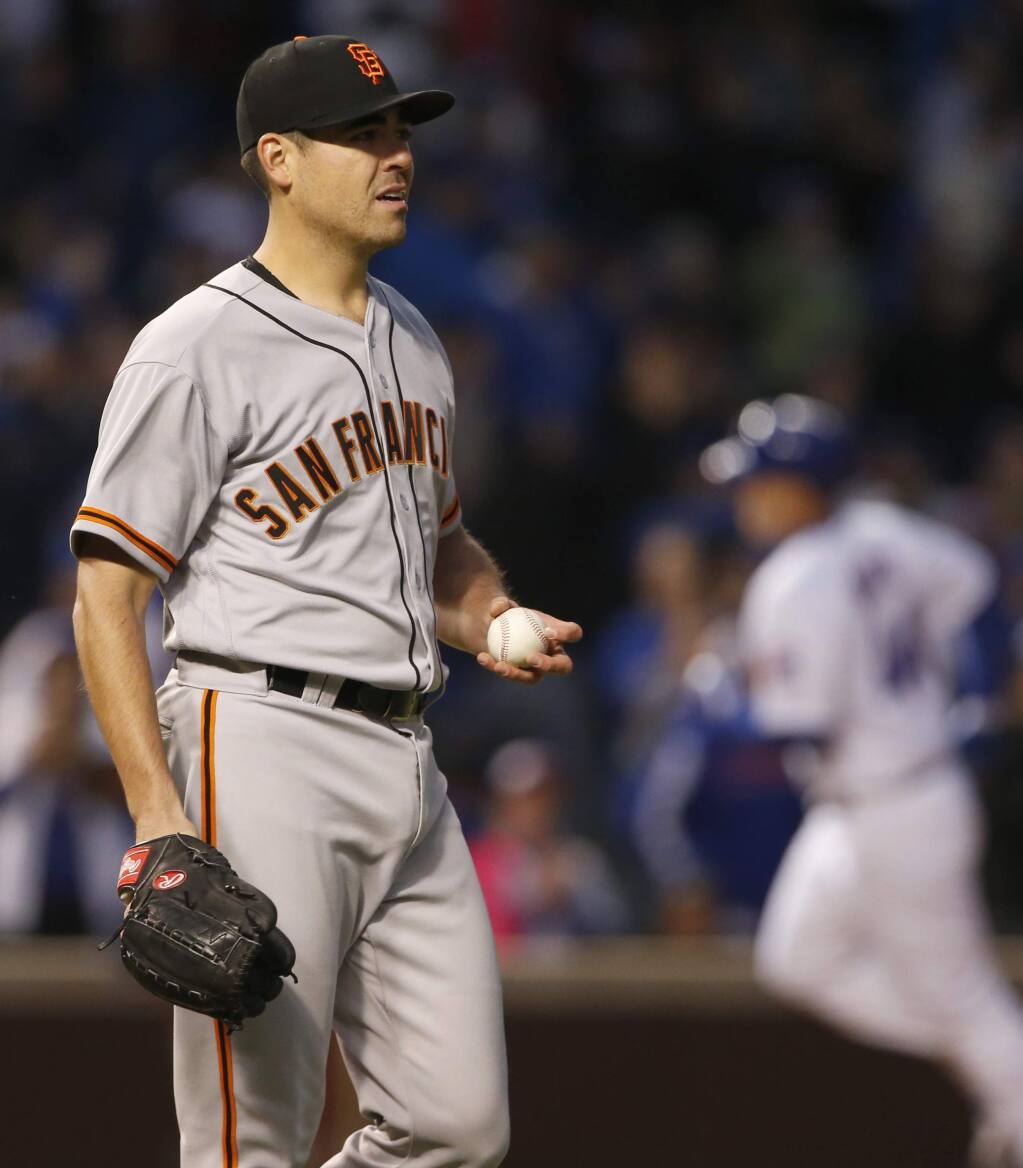 San Francisco Giants staring pitcher Matt Moore reacts after Chicago Cubs' Anthony Rizzo hit a solo home run in the second inning of a baseball game Wednesday, May 24, 2017, in Chicago. (AP Photo/Nam Y. Huh)