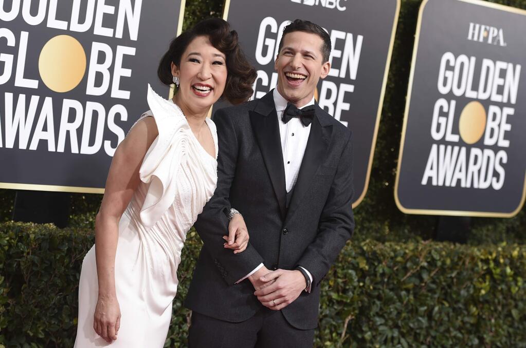 Hosts Sandra Oh, left, and Andy Samberg arrive at the 76th annual Golden Globe Awards at the Beverly Hilton Hotel on Sunday, Jan. 6, 2019, in Beverly Hills, Calif. (Photo by Jordan Strauss/Invision/AP)