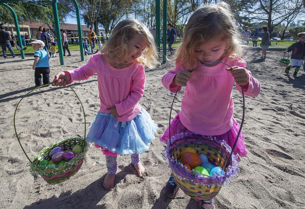 Two-year-old twin sisters Hazel and Ruby Ashimine showed off their loot at the annual Sonoma Plaza Easter egg hunt in 2016. (Photos by Robbi Pengelly/Index-Tribune)