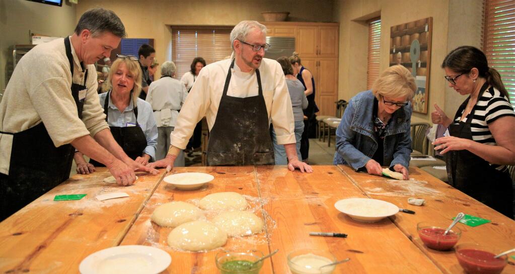 Chef Michael Kalanty, an artisan bread baker and author, shared his secrets for creating the perfect pizza in a hands-on cooking class at Ramekins Culinary School in Sonoma Saturday May 26, 2018. (Photos Will Bucquoy/For the Press Democrat).