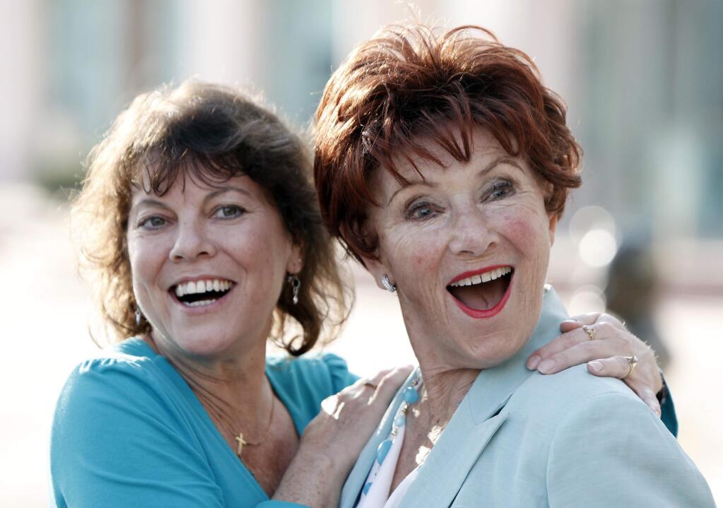FILE - In this June 18, 2009 file photo, actresses Erin Moran, left, and Marion Ross pose together at the Academy of Television Arts and Sciences' 'A Father's Day Salute to TV Dads' in the North Hollywood section of Los Angeles. Moran, the former child star who played Joanie Cunningham in the sitcoms 'Happy Days' and 'Joanie Loves Chachi,' has died at age 56. Police in Harrison County, Indiana said that she had been found unresponsive Saturday, April 22, 2017, after authorities received a 911 call. (AP Photo/Matt Sayles, File)