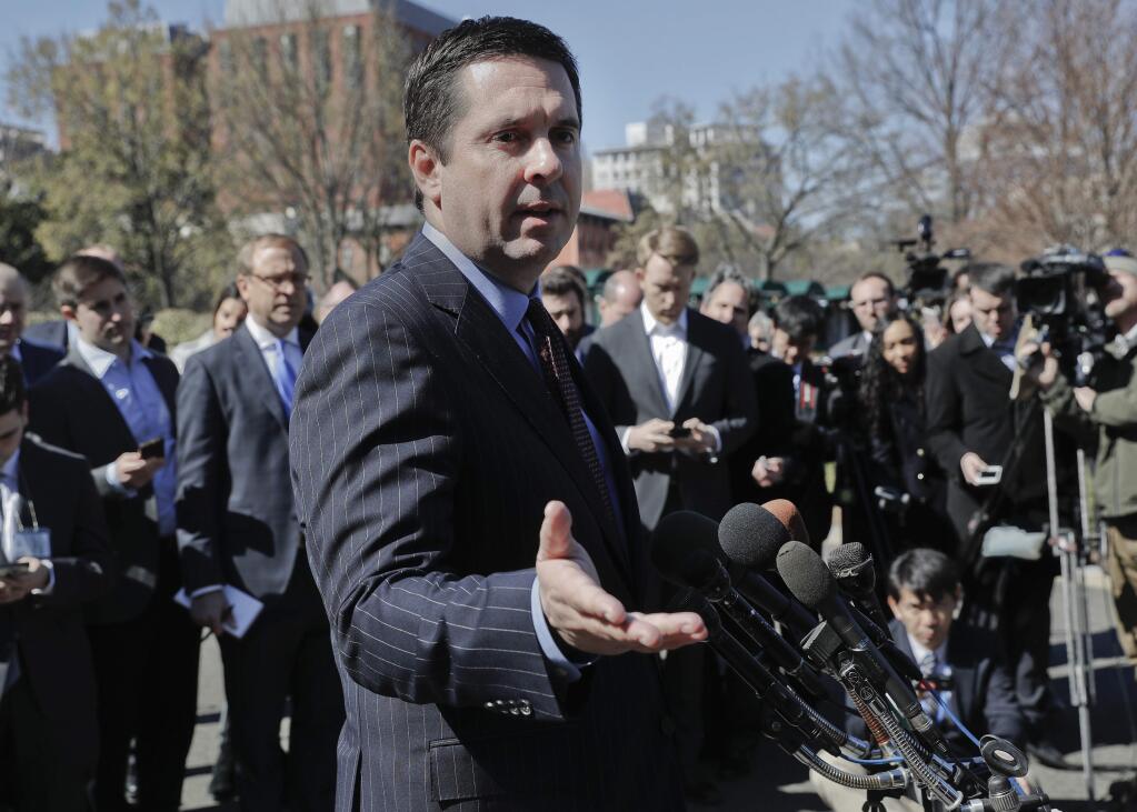 FILE - In this March 22, 2017 file photo, House Intelligence Committee Chairman Rep. Devin Nunes, R-Calif, speaks with reporters outside the White House in Washington following a meeting with President Donald Trump. Nunes' spokesman says the congressman met on the White House grounds with the source of the claim that communications involving President Donald Trump's associates were caught up in “incidental” surveillance. (AP Photo/Pablo Martinez Monsivais, File)