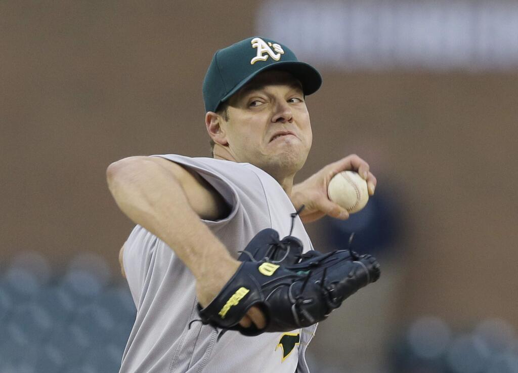 Oakland Athletics starting pitcher Rich Hill throws during the first inning of a baseball game against the Detroit Tigers, Tuesday, April 26, 2016, in Detroit. (AP Photo/Carlos Osorio)