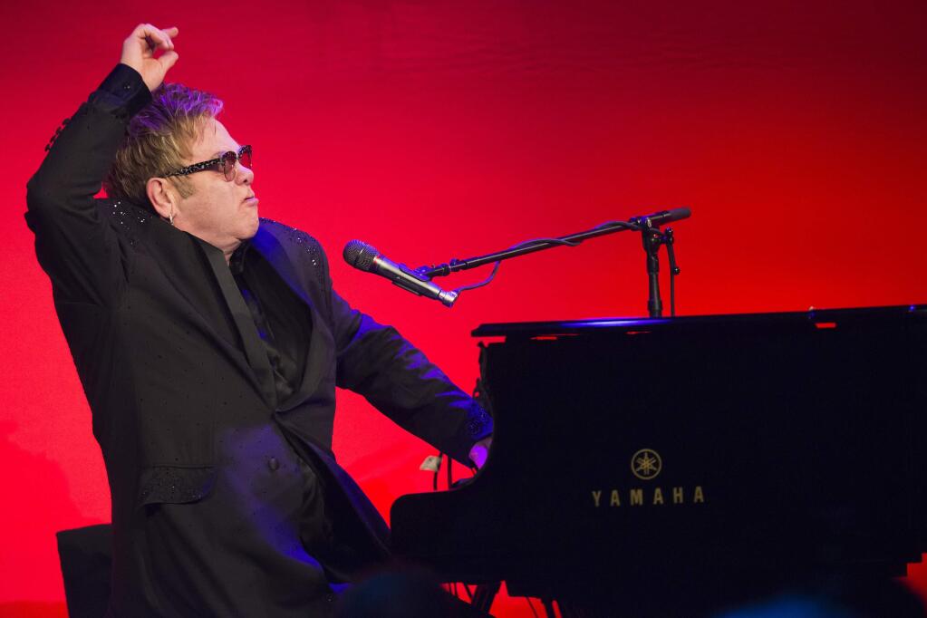 Elton John performs at the Elton John AIDS Foundations 13th Annual 'An Enduring Vision' benefit at Cipriani's Wall Street on Tuesday, Oct. 28, 2014, in New York. (Photo by Charles Sykes/Invision/AP)