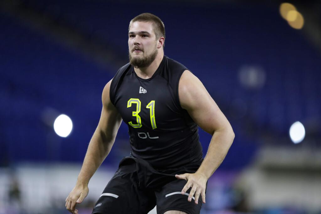 West Virginia offensive lineman Colton McKivitz, drafted by the 49ers, runs a drill at the NFL combine in Indianapolis, Friday, Feb. 28, 2020. (AP Photo/Michael Conroy)