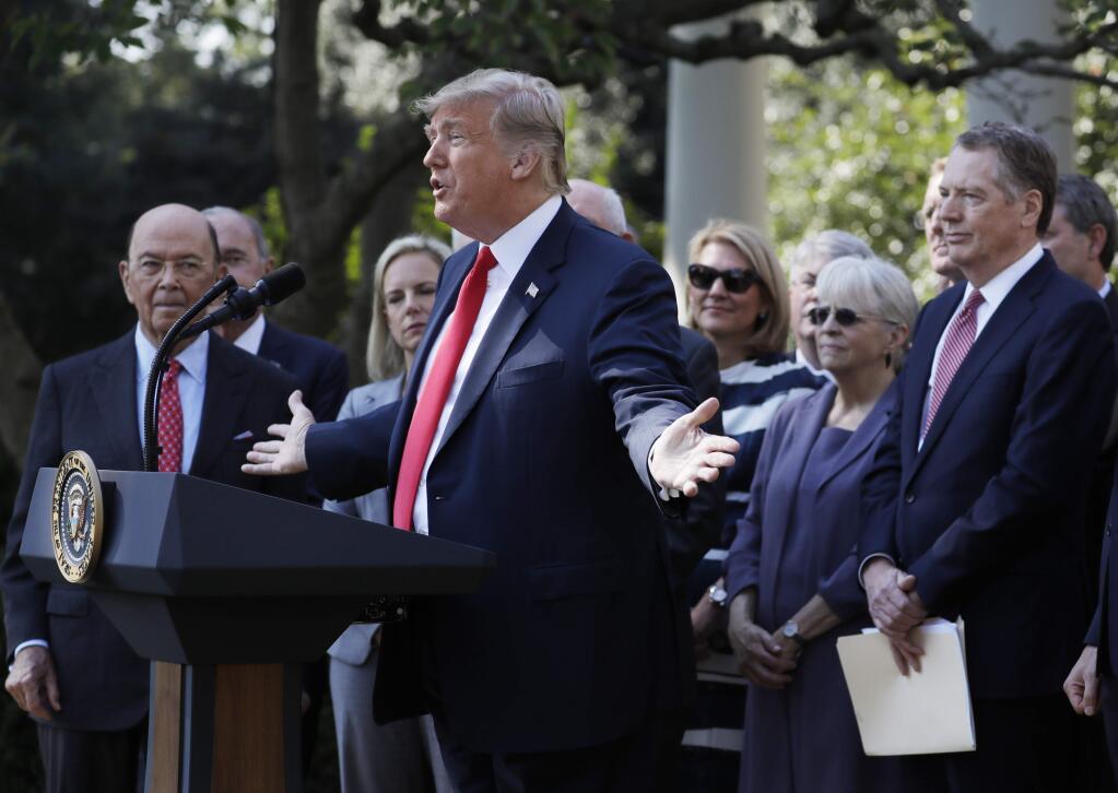 President Donald Trump delivers remarks on trade between the United States, Canada, and Mexico, in the Rose Garden of the White House, Monday, Oct. 1, 2018, in Washington. (AP Photo/Evan Vucci)