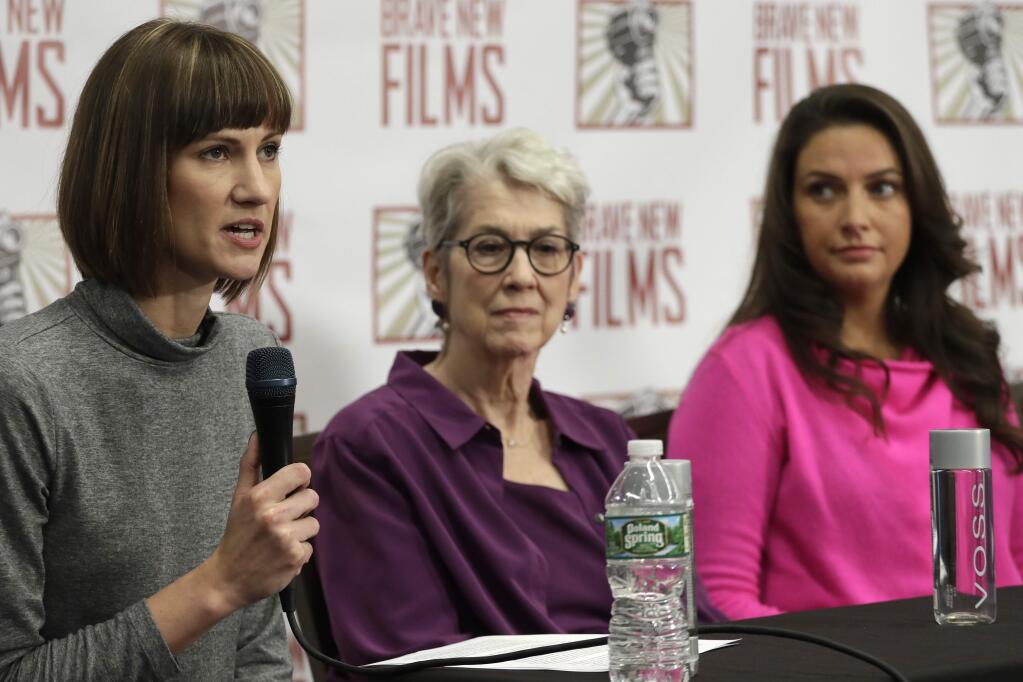 Rachel Crooks, Jessica Leeds and Samantha Holvey attend a Dec. 11 news conference in New York to discuss their accusations of sexual misconduct against Donald Trump. (MARK LENNIHAN / Associated Press)