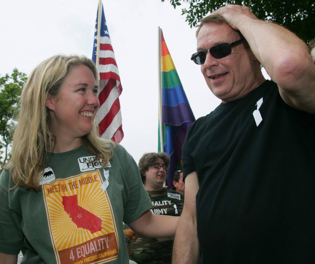 Organizer Robin Megehee and Activist Cleve Jones share a moment during a Meet in the Middle 4 Equality rally in Fresno, Calif. on Saturday, May 30, 2009 to protest the California Supreme Court decision to uphold Proposition 8 which bans gay marriage in the state Constitution. (AP Photo/Gary Kazanjian)
