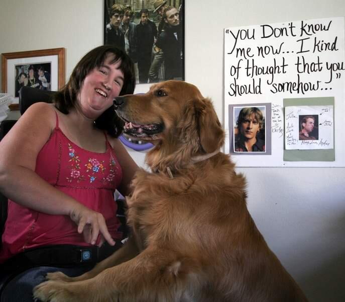 (File photo) Julie Reibel, 16, who has cerebral palsy, uses a service dog, Elliot, to help her.She participated in a statewide leadership program in Sacramento and is a Matchbox 20 fan. (August 2, 2006. Press Democrat / Jeff Kan Lee)