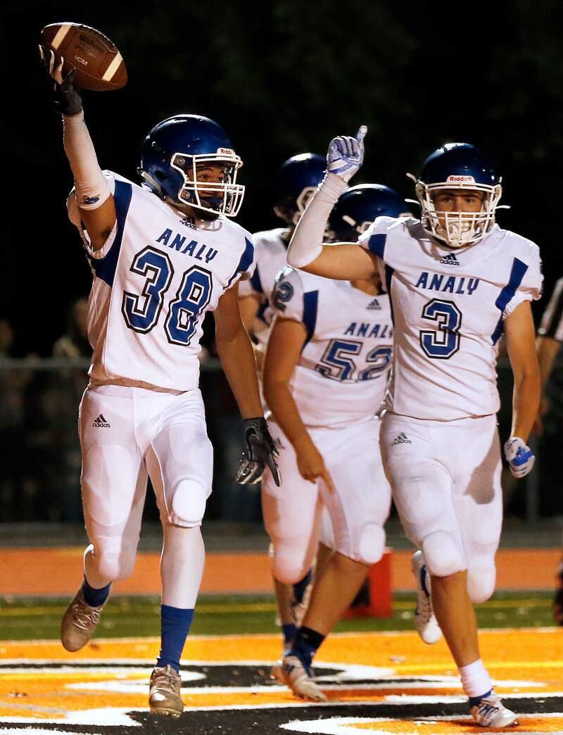 Analy's Kole Hunter, left, and Dylan Pederson celebrate after Hunter scored the game-winning touchdown during overtime between Analy and Santa Rosa. Analy plays rival El Molino tonight.(Alvin Jornada / The Press Democrat)