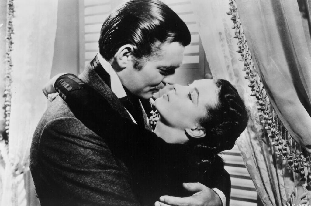 Rhett Buttler (Clark Gable) embraces Scarlett O'Hara (Vivien Leigh) during a scene from 'Gone With the Wind.' (New Line Cinema)