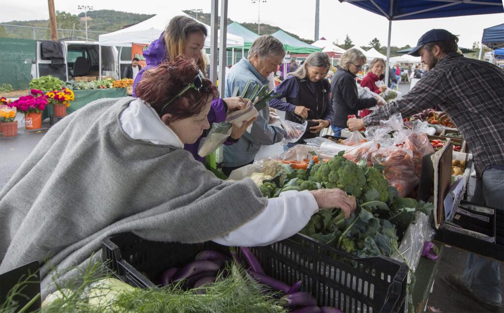 The farmers market, usually held on Fridays in the Arnold Field parking lot, will take place on Tuesday, Nov. 20, to allow customers to buy local produce before the Thanksgiving holiday. (Photo by Robbi Pengelly/Index-Tribune)
