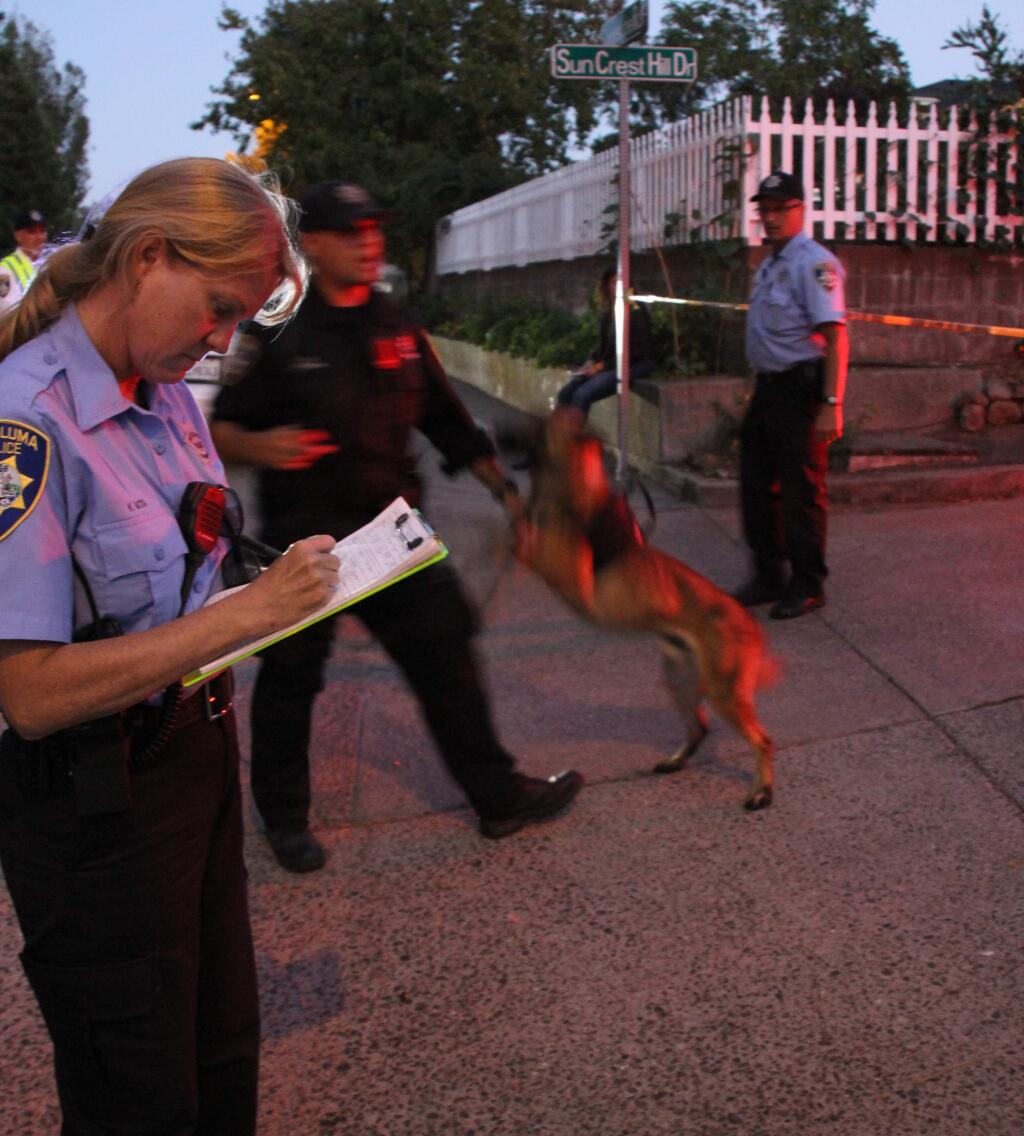 A K9 unit arrives on scene following a fatal shooting on Suncrest Hill Drive on Wednesday, Sept. 10, 2014. (VICTORIA WEBB/FOR THE ARGUS-COURIER)
