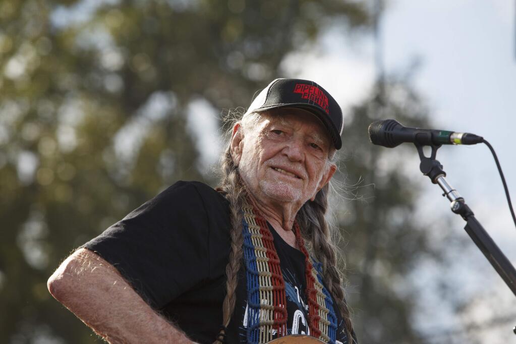 Willie Nelson performs at Harvest of Hope, a concert hosted by Art Tanderup and his wife Helen on their farm in Neligh, Neb., Sept. 27, 2014. Over the six years since the 1,179-mile crude oil pipeline that would run from Alberta province in Canada to Nebraska was first proposed, a group of Nebraska farmers, ranchers, Native Americans and city-dwelling environmentalists has held meeting after meeting to rally opposition. (Ryan Henriksen/The New York Times)