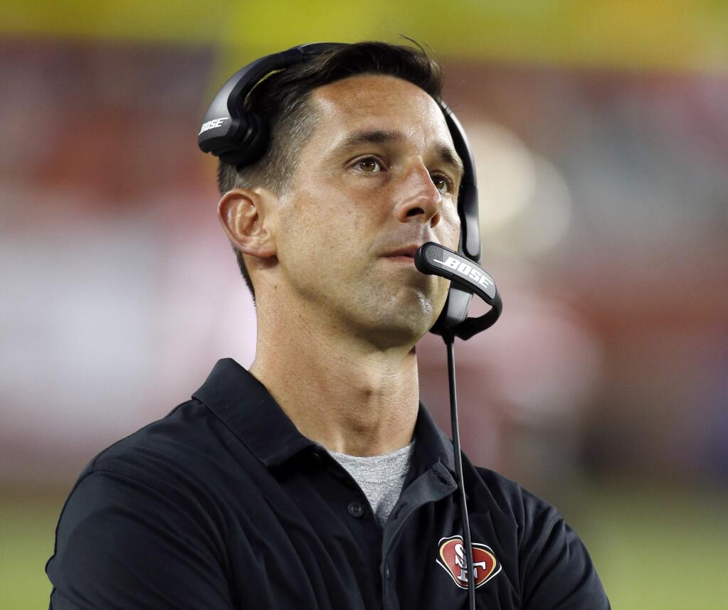 FILE - In this Aug. 19, 2017, file photo, San Francisco 49ers coach Kyle Shanahan watches from the sideline during the first half of a preseason NFL football game against the Denver Broncos, in Santa Clara, Calif. Kyle Shanahan was hired in San Francisco because of his success as an offensive coordinator. Two games into his tenure, the 49ers are still seeking their first touchdown. (AP Photo/D. Ross Cameron, File)