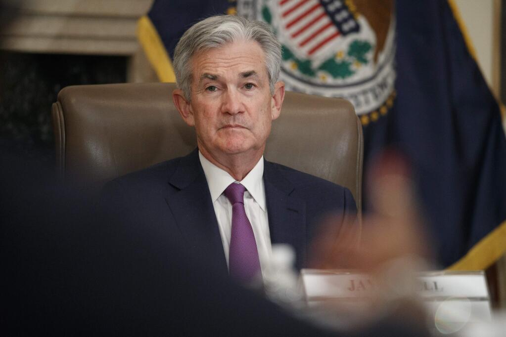 FILE - In this Oct. 4, 2019, file photo Federal Reserve Chairman Jerome Powell listens to feedback during a panel at the Federal Reserve Board Building in Washington. The Fed concludes its two-day meeting Wednesday, Oct. 30. (AP Photo/Jacquelyn Martin, File)